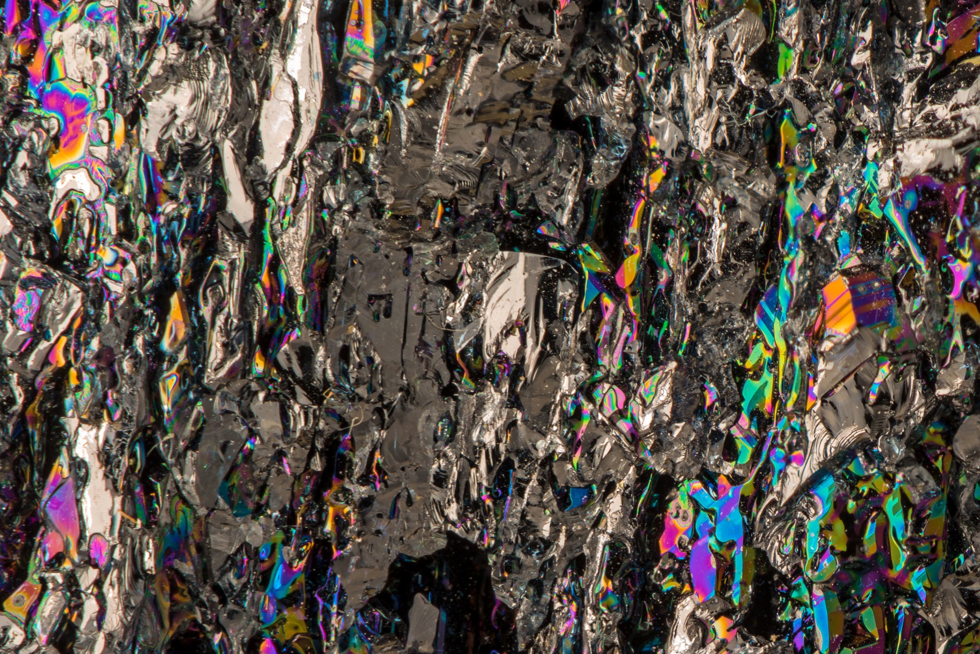 Focus Stacking using 14 frames. Silicon Carbide is a gemstone used in jewelry, aka moissanite. It is usually synthetic, nearly as hard as diamond and birefringent.