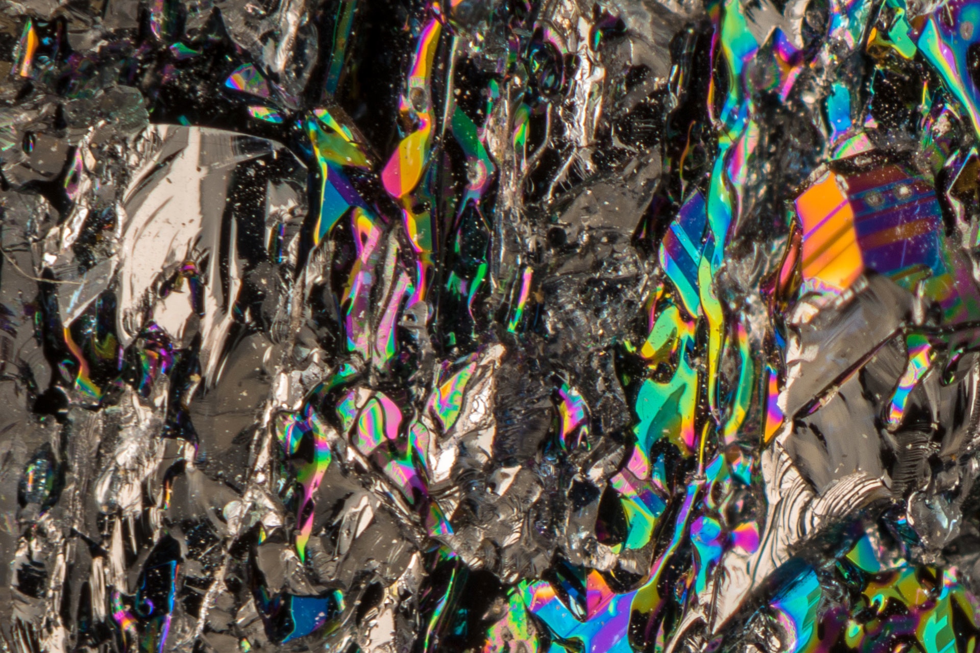 Focus Stacking using 14 frames. Silicon Carbide is a gemstone used in jewelry, aka moissanite. It is usually synthetic, nearly as hard as diamond and birefringent.
