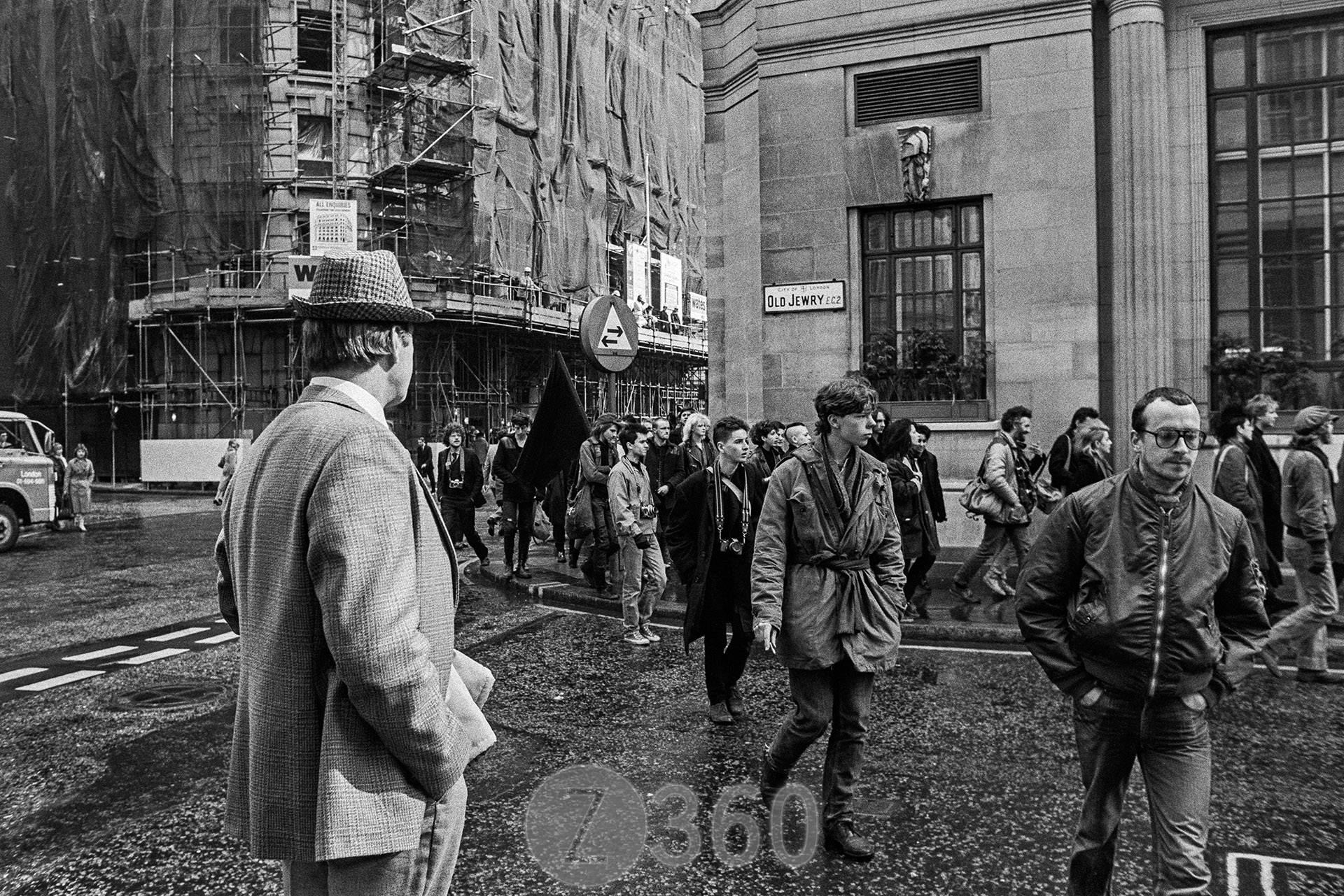 City gent surveys protestors