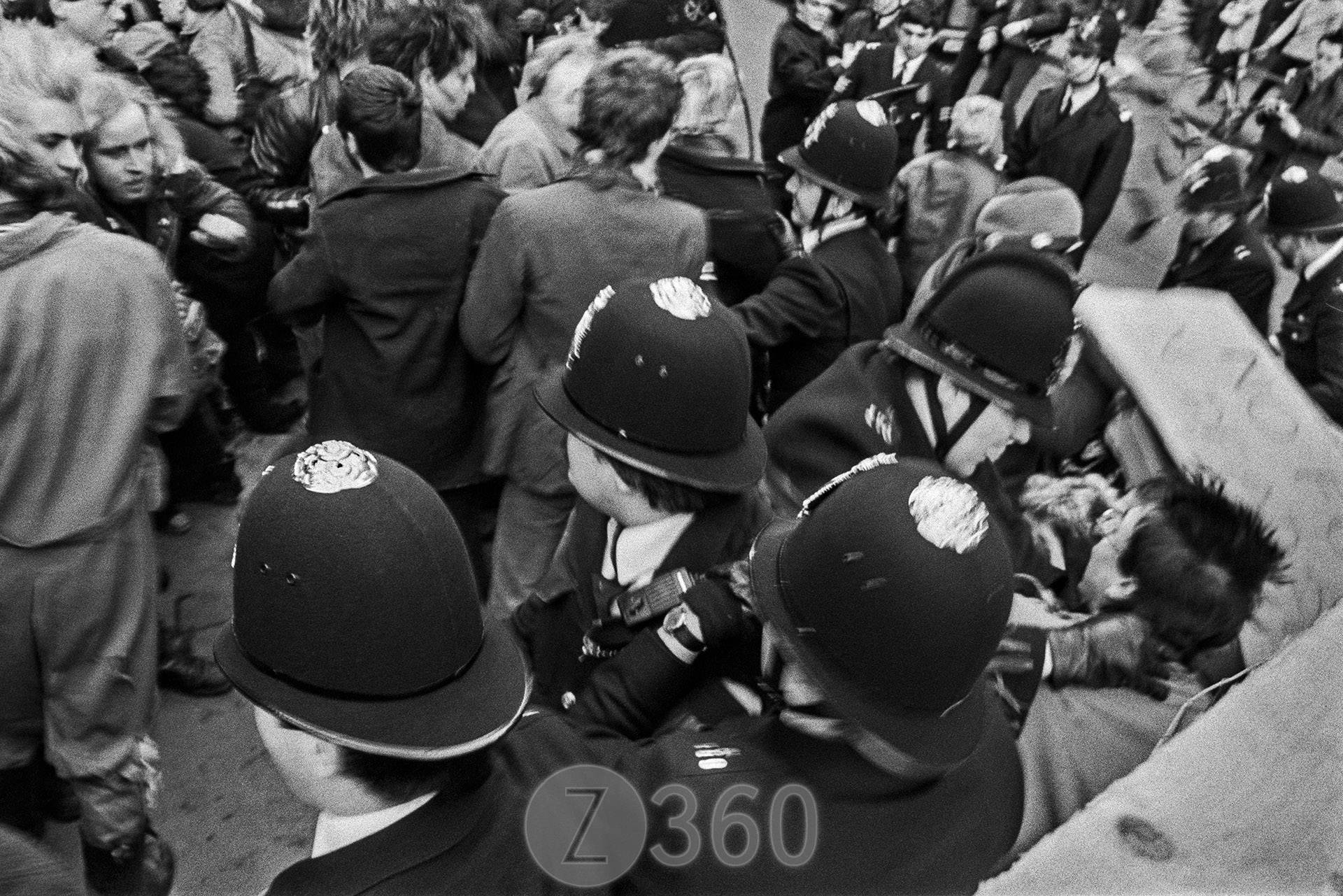 A protestor is choked